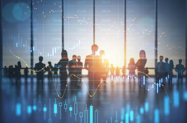Silhouettes of business executives against a stock chart, illustrating background screening as a risk management tool in the UAE