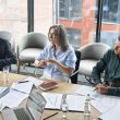 Board members discussing internal policies in a UAE office meeting room